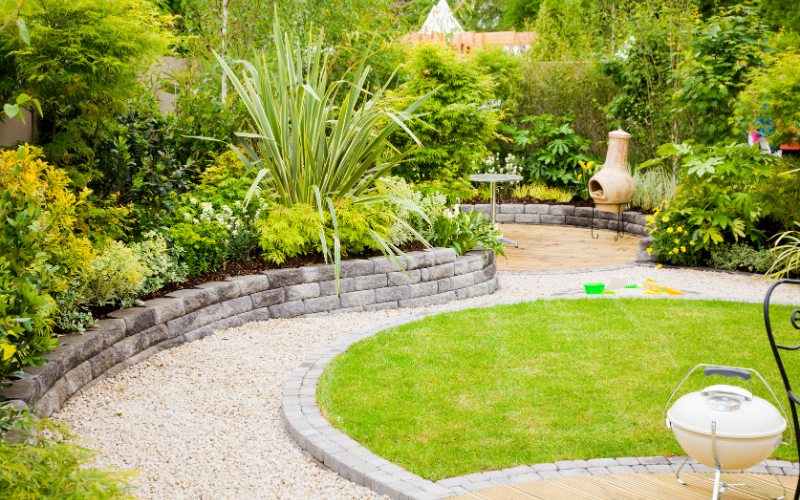 lanscaped garden with lawn, path and raised border