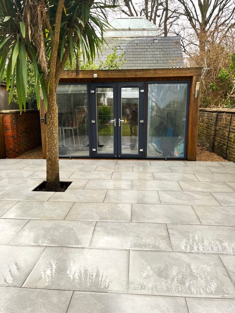 The finished result of a newly designed porcelain patio carried out by Lyuven Garden Maintenance company in Upper Tooting area of London, UK.