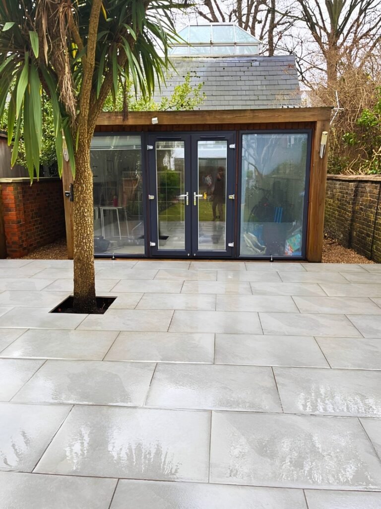 The finished result of a newly designed porcelain patio carried out by Lyuven Garden Maintenance company in Upper Tooting area of London, UK.